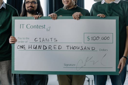 Group of men holding a $100,000 prize check after winning an IT contest.